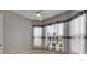 Bright bedroom featuring large windows, light-colored walls and ceiling fan at 1643 Emerald Dunes Dr, Sun City Center, FL 33573