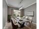 Stylish dining room features modern chandelier lighting and ample seating, ideal for hosting dinner parties at 1643 Emerald Dunes Dr, Sun City Center, FL 33573