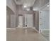 Grand foyer with tile flooring, high ceilings, chandelier, and arched doorways at 1643 Emerald Dunes Dr, Sun City Center, FL 33573
