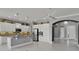 Modern kitchen with white cabinets, granite counters, stainless steel appliances, and an open layout at 1643 Emerald Dunes Dr, Sun City Center, FL 33573