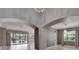 Bright Living Room showcases the interior with architectural arches leading to the lanai at 1643 Emerald Dunes Dr, Sun City Center, FL 33573