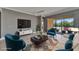 Bright living room with neutral walls and bright accents provides a cozy space for relaxation and entertaining at 1643 Emerald Dunes Dr, Sun City Center, FL 33573