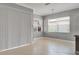 Bright living room featuring tile floors, crown molding, neutral walls, and vertical blinds at 1643 Emerald Dunes Dr, Sun City Center, FL 33573