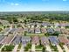 Aerial view of a well-planned community with lush greenery and tranquil ponds at 17610 Buckingham Garden Dr, Lithia, FL 33547