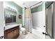 Bathroom with granite countertops, tiled floor, and white tub/shower combination at 17610 Buckingham Garden Dr, Lithia, FL 33547