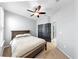 Bedroom with a comfortable bed, plush carpet, and a window with natural light at 17610 Buckingham Garden Dr, Lithia, FL 33547