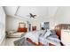 Spacious bedroom featuring tray ceiling, neutral walls, tiled floors and beautiful wooden bedroom furniture at 17610 Buckingham Garden Dr, Lithia, FL 33547