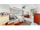 Bright bedroom offering lots of natural light, tiled floors, and neutral walls with view to the backyard at 17610 Buckingham Garden Dr, Lithia, FL 33547