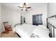 View of a bedroom featuring a ceiling fan and rocking chair at 17610 Buckingham Garden Dr, Lithia, FL 33547