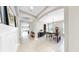 Hallway leads to a dining area with table and chairs, offering a glimpse into the kitchen at 17610 Buckingham Garden Dr, Lithia, FL 33547