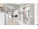 Hallway showcasing archways, tile flooring, and decorative wall accents at 17610 Buckingham Garden Dr, Lithia, FL 33547
