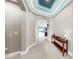 Bright foyer leading to an open-concept living area, complemented by modern decor and finishes at 17610 Buckingham Garden Dr, Lithia, FL 33547