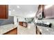 Open kitchen featuring a large island, stainless steel appliances, and tile flooring at 17610 Buckingham Garden Dr, Lithia, FL 33547
