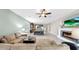 Open floor plan with living room, dining area, kitchen and fireplace for easy entertaining at 17610 Buckingham Garden Dr, Lithia, FL 33547