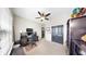 A home office featuring a desk, computer, and ample storage space with a light, neutral color palette at 17610 Buckingham Garden Dr, Lithia, FL 33547