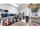 Walk-in closet boasting metal racks for hanging and storing clothing with shelves for shoes and linens at 17610 Buckingham Garden Dr, Lithia, FL 33547
