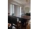 Bright dining area with a wooden table, natural light, and a functional layout at 18063 Parrot Rd, Weeki Wachee, FL 34614