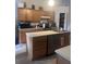 Functional kitchen featuring an island, ample cabinetry, and modern appliances at 18063 Parrot Rd, Weeki Wachee, FL 34614
