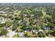 Aerial view of home with a large lot surrounded by mature trees in a residential area at 1815 Durant Rd, Valrico, FL 33596