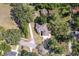 Aerial view of a large home with mature trees and a long driveway on a spacious lot at 1815 Durant Rd, Valrico, FL 33596