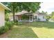 Spacious backyard featuring a partial view of the home with a chainlink fence at 1815 Durant Rd, Valrico, FL 33596