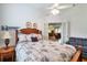 Comfortable bedroom features a ceiling fan and view into the living area at 1815 Durant Rd, Valrico, FL 33596