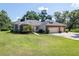 Charming one-story home with brick and stucco accents and a well-manicured lawn at 1815 Durant Rd, Valrico, FL 33596