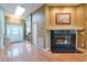 Inviting foyer with hardwood floors, a decorative fireplace, and a view of the living spaces at 1815 Durant Rd, Valrico, FL 33596