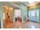 Foyer features hardwood floors, a statement front door, and an open view to the bedroom at 1815 Durant Rd, Valrico, FL 33596