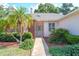 Inviting home entrance with a lush, landscaped front yard and charming brick accents at 1815 Durant Rd, Valrico, FL 33596