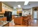 Spacious kitchen with wooden cabinets, granite countertops, and modern appliances at 1815 Durant Rd, Valrico, FL 33596