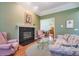 Open-concept living room showcasing a fireplace and access to other rooms at 1815 Durant Rd, Valrico, FL 33596