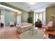 Bright living room featuring hardwood floors, skylight, and comfortable seating at 1815 Durant Rd, Valrico, FL 33596