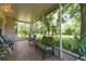 Inviting screened patio with cozy seating and views of the backyard at 1815 Durant Rd, Valrico, FL 33596