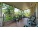 Inviting screened patio with tile flooring and comfortable seating, perfect for enjoying the outdoors at 1815 Durant Rd, Valrico, FL 33596