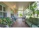 Relaxing screened patio with comfortable seating and views of the landscaped yard at 1815 Durant Rd, Valrico, FL 33596