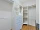 Walk-in closet boasts custom shelving, drawers, and plenty of hanging space at 1815 Durant Rd, Valrico, FL 33596