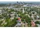 Aerial view showcasing property's location near the city, surrounding trees and neighborhood at 1825 2Nd S St, St Petersburg, FL 33705