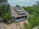 Aerial view of the home, featuring solar panels and a spacious brick courtyard at 1825 2Nd S St, St Petersburg, FL 33705