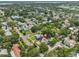 Aerial view of a home nestled among lush trees in a vibrant neighborhood at 1825 2Nd S St, St Petersburg, FL 33705