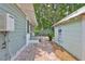 Inviting backyard area with brick pavers, lush greenery, and access to an auxiliary unit at 1825 2Nd S St, St Petersburg, FL 33705