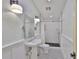 A newly renovated bathroom features black and white tile, modern fixtures, and a subway tile shower at 1825 2Nd S St, St Petersburg, FL 33705