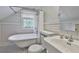 Stylish bathroom with vintage fixtures and a classic black-and-white tile floor at 1825 2Nd S St, St Petersburg, FL 33705
