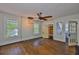 Spacious bedroom featuring hardwood floors, ample natural light, stylish lighting, and a walk-in closet at 1825 2Nd S St, St Petersburg, FL 33705