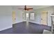 Spacious bedroom with dark floors and entrances to the porch and hallway at 1825 2Nd S St, St Petersburg, FL 33705