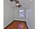 Well-lit bedroom showcasing hardwood floors and a charming vintage-style ceiling fan at 1825 2Nd S St, St Petersburg, FL 33705