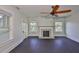 Inviting bedroom with dark wood floors, fireplace, and ample natural light at 1825 2Nd S St, St Petersburg, FL 33705
