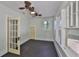 Sunlit bedroom boasts multiple windows, inviting natural light, and a light-colored door at 1825 2Nd S St, St Petersburg, FL 33705