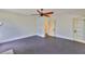 Neutral bedroom featuring dark floors and a door to the hallway at 1825 2Nd S St, St Petersburg, FL 33705