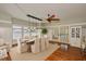 Elegant dining room with a modern chandelier, hardwood floors and french doors leading to an enclosed patio at 1825 2Nd S St, St Petersburg, FL 33705